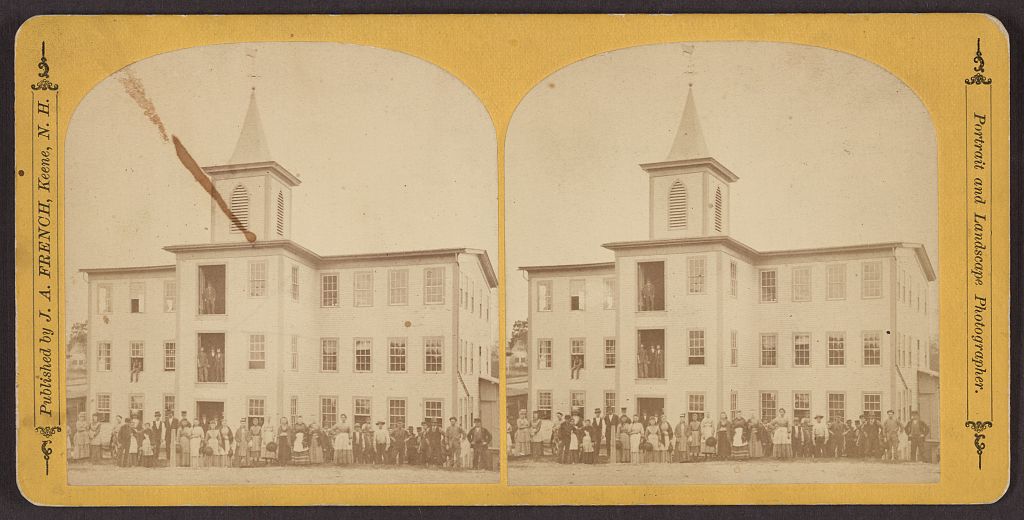 Two views on a yellow stereo card show a long three-story building, a central tower, and a group posed outside. The mount names J. A. French of Keene, New Hampshire.